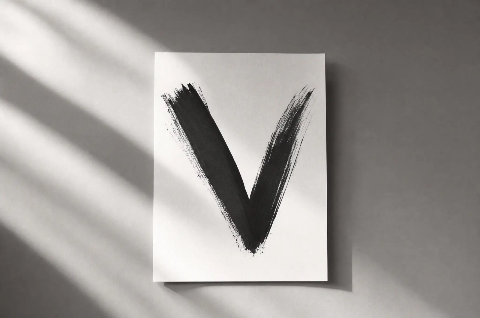 A single sheet of paper with a bold black brushstroke